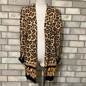 light cover top cardigan size 14 has padded shoulders